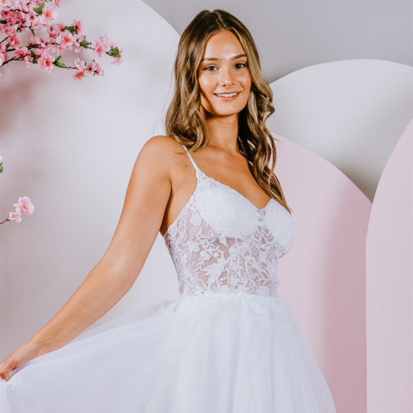 Delicate floral lace creates a translucent bodice