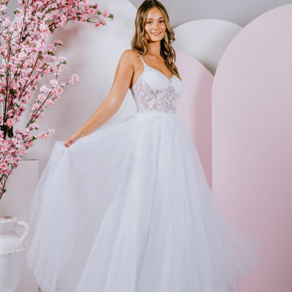 Delicate floral lace creates a translucent bodice