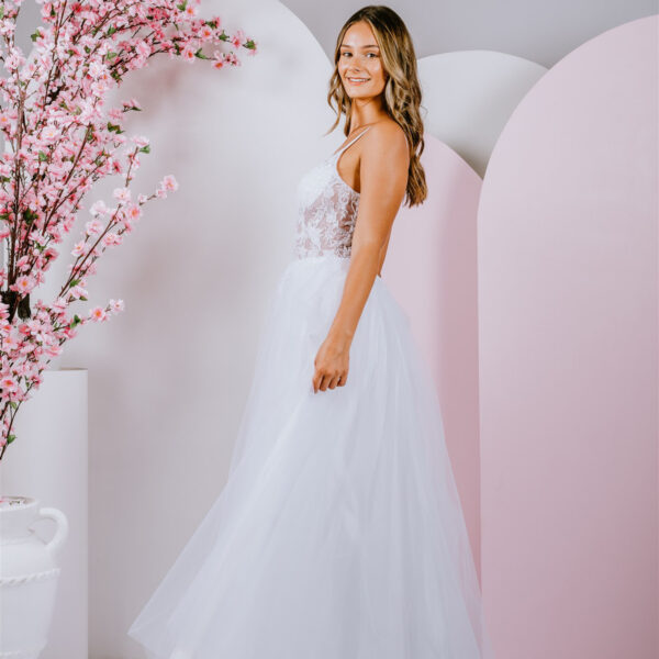 Delicate floral lace creates a translucent bodice