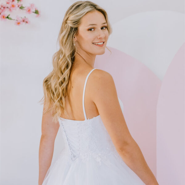 Delicately placed floral lace deb gown
